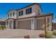 Beautiful two-story home with a three-car garage, manicured landscaping, and lovely stone accents at 12362 W Marguerite Ave, Avondale, AZ 85323