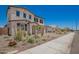 Attractive two-story home with a large driveway, two-car garage, desert landscaping, and sidewalk at 12362 W Marguerite Ave, Avondale, AZ 85323