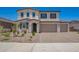 Welcoming two-story home with a spacious two-car garage and well-maintained desert landscaping at 12362 W Marguerite Ave, Avondale, AZ 85323