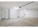 Spacious two-car garage with finished concrete floors and bright lighting at 12362 W Marguerite Ave, Avondale, AZ 85323