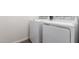 Modern white washer and dryer appliances in laundry area at 12362 W Marguerite Ave, Avondale, AZ 85323