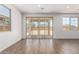 Bright living area with tile floors features sliding doors and bright windows overlooking the backyard at 12362 W Marguerite Ave, Avondale, AZ 85323