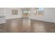 Living area with tile floors features bright windows and sliding doors leading to the backyard at 12362 W Marguerite Ave, Avondale, AZ 85323