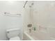 Clean, white bathroom features a shower-tub combination and white fixtures at 12739 W Merrell St, Avondale, AZ 85392