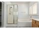 This primary bathroom features a walk-in shower, soaking tub, and double vanity sink at 12739 W Merrell St, Avondale, AZ 85392