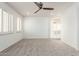 Large bedroom features abundant natural light, plush carpet, and a neutral color palette at 12739 W Merrell St, Avondale, AZ 85392