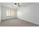 Bedroom features carpet, shutters and a ceiling fan at 12739 W Merrell St, Avondale, AZ 85392