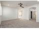Bedroom with plush carpet, ceiling fan, and bright lighting at 12739 W Merrell St, Avondale, AZ 85392