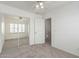 Bedroom with mirrored closet doors, carpet, and white trim at 12739 W Merrell St, Avondale, AZ 85392