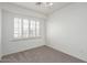 This bedroom offers natural light and plush carpet at 12739 W Merrell St, Avondale, AZ 85392