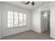 Clean bedroom with shutters, ceiling fan, and neutral carpet at 12739 W Merrell St, Avondale, AZ 85392