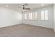 Spacious bedroom with large windows, plush carpet, and neutral color scheme at 12739 W Merrell St, Avondale, AZ 85392