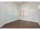 Bedroom featuring wood-look flooring, neutral walls, and a bright window with shutter blinds at 12739 W Merrell St, Avondale, AZ 85392