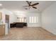 Bright dining room with tile flooring, neutral walls, built-in seating, and a modern chandelier at 12739 W Merrell St, Avondale, AZ 85392