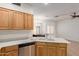 Kitchen boasts stainless steel appliances, ample counter space, and seamless flow to dining area at 12739 W Merrell St, Avondale, AZ 85392