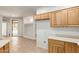 Bright kitchen showcases tile flooring and seamless flow to the outdoor area at 12739 W Merrell St, Avondale, AZ 85392
