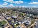 This aerial view shows the city skyline with lush landscaping and a nearby highway at 1618 W Culver St, Phoenix, AZ 85007