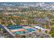This aerial view shows the lush greenery of a golf course and tennis courts at 1618 W Culver St, Phoenix, AZ 85007