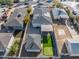 This aerial view showcases the property with a putting green, detached garage, and solar panels at 1618 W Culver St, Phoenix, AZ 85007