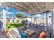 Relaxing backyard featuring a covered patio and synthetic grass lawn at 1618 W Culver St, Phoenix, AZ 85007