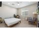 Cozy bedroom with a bed, desk, chair, and modern decor at 1618 W Culver St, Phoenix, AZ 85007