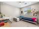 Comfortable bedroom featuring two beds, a desk, and a ceiling fan at 1618 W Culver St, Phoenix, AZ 85007