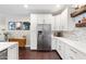 Kitchen with stainless steel appliances, modern cabinets and hardwood floors at 1618 W Culver St, Phoenix, AZ 85007