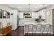 Bright kitchen featuring white cabinetry, an island, and modern appliances at 1618 W Culver St, Phoenix, AZ 85007