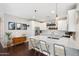 Open kitchen with white cabinets, a center island, and stylish decor at 1618 W Culver St, Phoenix, AZ 85007
