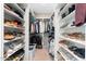 Organized walk-in closet with built-in shelving for shoes, clothing, and accessories at 1618 W Culver St, Phoenix, AZ 85007