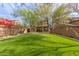 Artificial turf backyard with a soccer goal and raised garden beds at 18196 N 92Nd St, Scottsdale, AZ 85255
