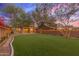 Large backyard featuring artificial turf and a pavered patio area at 18196 N 92Nd St, Scottsdale, AZ 85255