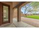Covered patio with access to backyard and view of lawn at 18196 N 92Nd St, Scottsdale, AZ 85255