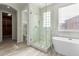 Spa-like bathroom featuring a large shower and a freestanding bathtub at 18196 N 92Nd St, Scottsdale, AZ 85255