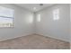 Well-lit bedroom featuring neutral decor and carpet flooring at 18196 N 92Nd St, Scottsdale, AZ 85255