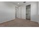 Comfortable bedroom with carpet flooring and access to a hallway at 18196 N 92Nd St, Scottsdale, AZ 85255
