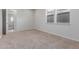 Spacious bedroom with carpet flooring and access to another room at 18196 N 92Nd St, Scottsdale, AZ 85255