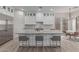 Spacious kitchen with white cabinets, large island, and stainless steel appliances at 18196 N 92Nd St, Scottsdale, AZ 85255