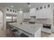 Large kitchen island with marble countertops and seating for four at 18196 N 92Nd St, Scottsdale, AZ 85255