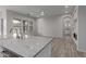 Open concept kitchen and living room with modern finishes and backyard view at 18196 N 92Nd St, Scottsdale, AZ 85255