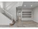 Two-story living room with high ceilings, wood floors, and a staircase at 18196 N 92Nd St, Scottsdale, AZ 85255