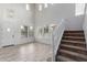 Two-story living room with high ceilings, wood floors, and a staircase at 18196 N 92Nd St, Scottsdale, AZ 85255