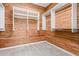 Large walk-in closet with wood-paneled walls and ample shelving at 18196 N 92Nd St, Scottsdale, AZ 85255