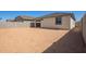 The backyard features a blank canvas and rear of the home with covered patio at 18366 W Poston Dr, Surprise, AZ 85387