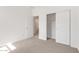 Bedroom featuring a closet with sliding doors and a view into the connected bathroom at 18366 W Poston Dr, Surprise, AZ 85387