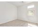 Bedroom with neutral carpet, white walls, and window to allow for natural light at 18366 W Poston Dr, Surprise, AZ 85387