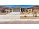 Lovely single-story home with a neutral-toned exterior, a spacious two-car garage, and fresh desert landscaping at 18366 W Poston Dr, Surprise, AZ 85387