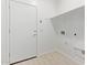 Clean mud room area with plank flooring, a door to outside, and washer/dryer hookups at 18366 W Poston Dr, Surprise, AZ 85387