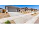 Attractive single-story home with a large two-car garage and tidy front yard landscaping in a suburban neighborhood at 18366 W Poston Dr, Surprise, AZ 85387
