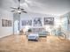 Living room with fireplace, couch, and wood-look floors at 18825 N 40Th Pl, Phoenix, AZ 85050